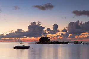 Pier at Olhuveli Beach and Spa Resort at sunset, South Male Atoll, Kaafu Atoll, Maldives Pier at Olhuveli Beach and Spa Resort at sunset, South Male Atoll, Kaafu Atoll, Maldives