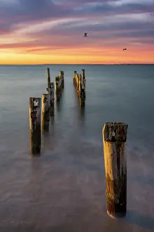 Dock Prints: Pier pillars at sunrise at beach on Cape Cod, East Falmouth, Massachusetts, USA