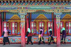 Pilgrims spinning prayer wheels at Wutun Si, (Lower Monastery), Longwu, China