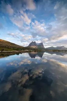 Midnight Sun Prints: Pink clouds of midnight sun reflected in the clear water of blue sea Anepollen Fjord