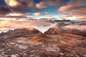 Parco Naturale Puez Odle Prints: Pink clouds in the romantic sky at dawn over mountains of Puez Odle Natural Park in autumn