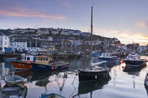 Pink dawn sky above Mevagissey harbour, Cornwall, England. Spring (May) 2015