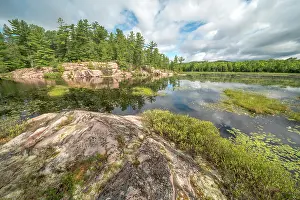 Provincial Park Prints: Pink Granite outcrops at small lake in Killarney Provincial Park, Ontario, Canada