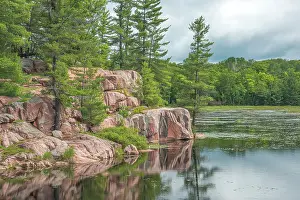 Provincial Park Prints: Pink Granite outcrops at small lake in Killarney Provincial Park, Ontario, Canada