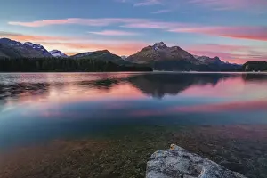 Lake Sils Prints: Pink sky at dawn illuminates the peaks reflected in Lake Sils Engadine Canton of