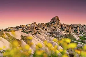 Turkish Prints: Pink sunset over Uchisar castle, Cappadocia, Nevsehir Province, Central Anatolia, Turkey