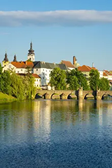 Bohemia Prints: Pisek Stone bridge over Otava River with Pisek Castle in background