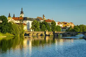Pisek Stone bridge over Otava River with Pisek Castle in background, Pisek, South Bohemian Region, Czech Republic