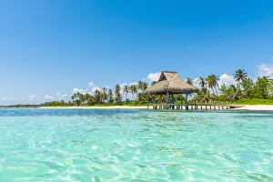 Playa Blanca, Punta Cana, Dominican Republic, Caribbean Sea. Thatched hut on the beach Playa Blanca, Punta Cana, Dominican Republic, Caribbean Sea. Thatched hut on the beach