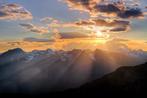 Plays of light at sunset through the clouds. Alps, Lombardy, Italy Plays of light at sunset through the clouds. Alps, Lombardy, Italy