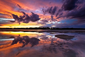 Wetland Prints: Po river park, Piedmont, Italy. Colours and clouds on a wetland near the Po river