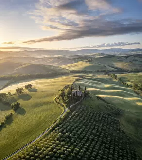 Farm Collection: Podere Belvedere and the surrounding countryside at sunrise