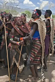 East Pokot District Collection: Pokot men, women and girls dancing to celebrate an Atelo ceremony