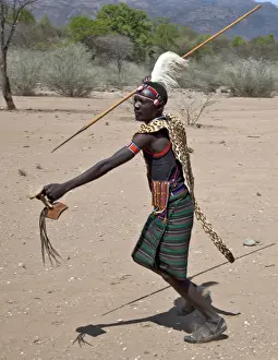 Jewelry Prints: A Pokot warrior wearing a leopard skin cape celebrates an Atelo ceremony, spear in hand