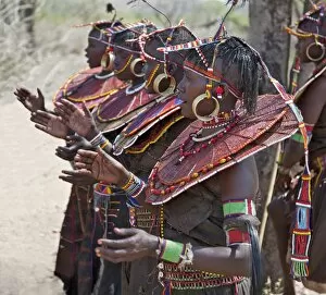 Ornaments Collection: Pokot women wearing traditional beaded ornaments and brass earrings denoting their married status