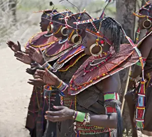 Pokot women wearing traditional beaded ornaments and brass earrings denoting their married status