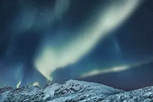 Starry Sky Prints: Polar light (Aurora Borealis) over snowcovered mountains - Norway, Troms, Kvaloya