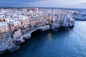 Adriatic Sea Prints: Polignano a mare at dusk, drone view, Polignano a Mare, Bari province, Apulia, Italy