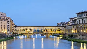 Ponte Vecchio on the Arno river and buildings in the old town at dawn, Florence (Firenze)