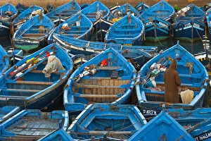 Painted Gallery: Port, Essaouira, Morocco. Typical blue portoguese boats moored at the port