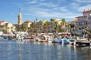 Port harbor filled with traditional wooden fishing boats at Sanary-sur-Mer, Var department