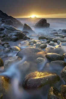 Porth Nanven pebble beach at sunset, St Just, Cornwall, England