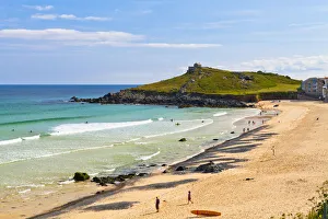 Porthmeor Beach with St Nicholas Chapel in the background, St Ives, Cornwall, England, UK Porthmeor Beach with St Nicholas Chapel in the background, St Ives, Cornwall, England, UK