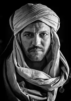 B And W Prints: Portrait of a Berber man wearing traditional headscarf (Cheche), Merzouga, Morocco