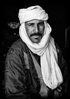Wearing Prints: Portrait of a Berber man wearing traditional headscarf (Cheche), Merzouga, Morocco