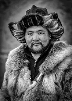 Western Mongolia Prints: Portrait of a Kazakh Eagle Hunter wearing traditional fur clothing, Western Mongolia, Asia