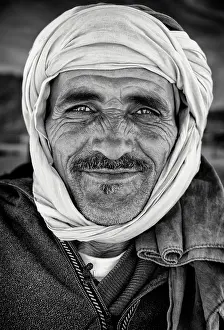 Wearing Prints: Portrait of a local man wearing traditional headscarf (Cheche)