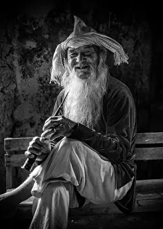 Old Man Prints: Portrait of an old man wearing conical hat and holding traditional musical instrument