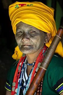 Portrait of a woman with traditional tattooed face in Mindat, Chin State, Myanmar