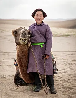 Gobi Desert Prints: Portrait of a young camel herder, Khongor Dunes, Gobi Desert, Mongolia, Asia