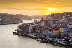 Ribeira Prints: Portugal, Douro Litoral, Porto. Sunset over the UNESCO listed Ribeira district, viewed