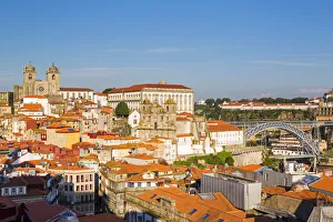 Portugal, Douro Litoral, Porto. An evening view of Se Cathedral and Igreja de Sao