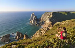 Isolation Prints: Portugal, Estramadura, Ursa woman sitting on cliff edge (MR)