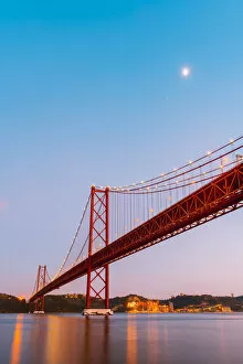 Portugal, Lisbon. The 25 de Abril Bridge across the Tagus river and Cristo Rei (Christ