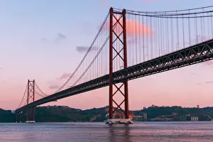 Portugal, Lisbon. The 25 de Abril Bridge across the Tagus river and Cristo Rei (Christ