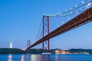 Portugal, Lisbon. The 25 de Abril Bridge across the Tagus river and Cristo Rei (Christ