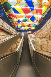 Portugal, Lisbon. Escalators and the colorful decorations at Olaias subway station
