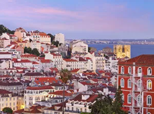 Portugal, Lisbon, Overview of Se Cathedral and city at Dusk