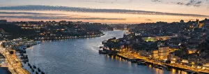 Images Dated 17th July 2018: Portugal, Norte region, Porto (Oporto). Douro river banks at dusk with Arrabida bridge