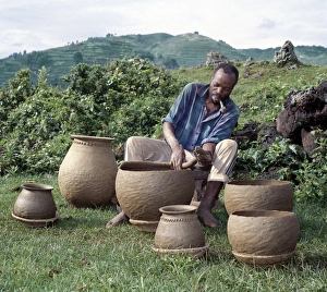 Hand Crafted Prints: A potter fashions cooking pots by the coil method