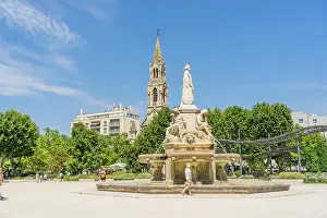 Fountains Prints: Pradier Fountain and the Church of Sainte Perprtue in the background, Nimes, Gard, France
