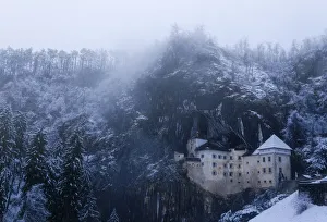 Predjama castle during a snowy day in the middle of the wintern, Predjama, Slovenia