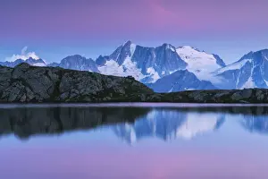Presanella group at sunset from Strino lake in Trentino Alto Adige, Italy