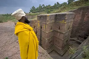 Ethiopia Prints: Priest outside the Sunken Rock Hewn church of Bet Giyorgis