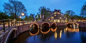 Prinsengracht and Reguliersgracht Canals and Bridges at twilight, Amsterdam, North Holland Prinsengracht and Reguliersgracht Canals and Bridges at twilight, Amsterdam, North Holland