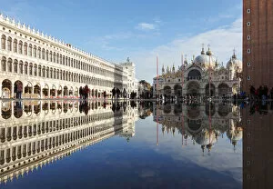 Images Dated 21st November 2018: Procuratie Vecchie, Basilica di San Marco and Clocktower are Reflected in the High Water